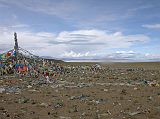 Tibet Kailash 05 To Tirthapuri 02 First View of Lake Manasarovar We circled the prayer flags at the top of this innocent pass (4700m) with holy Lake Manasarovar at our feet, just 6km before Hor Qu. Alas, Kailash and Gurla Mandhata still remained hidden from view.